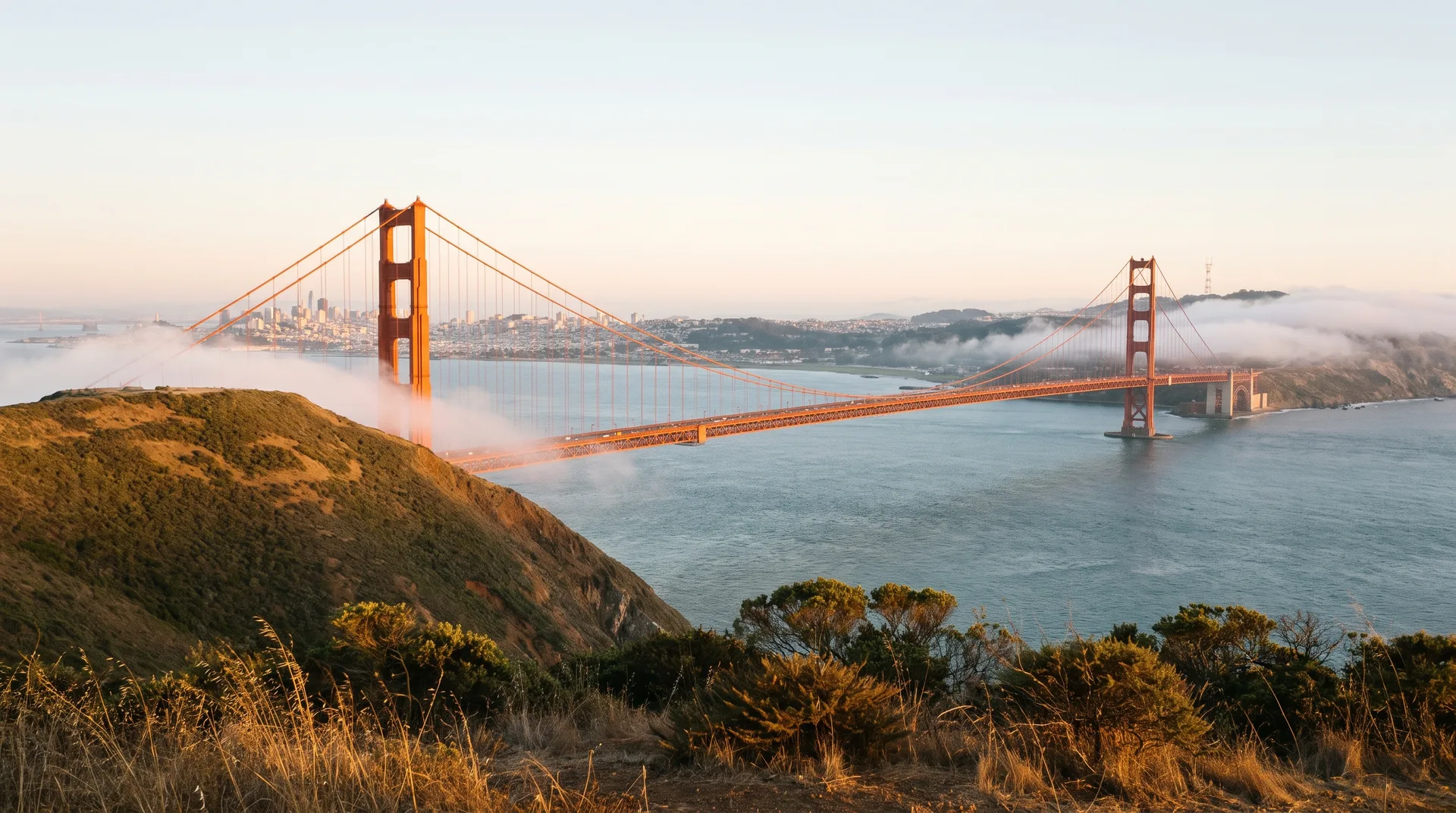 The Golden Gate Bridge seen from the Marin headlands in soft fog.
